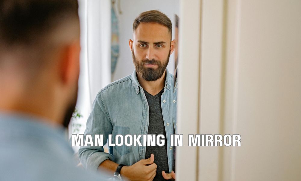 Man Looking In Mirror