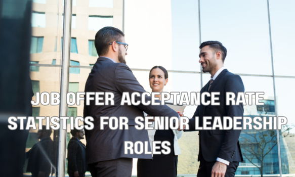 Senior business executives shaking hands after reaching a job offer agreement in a corporate office.