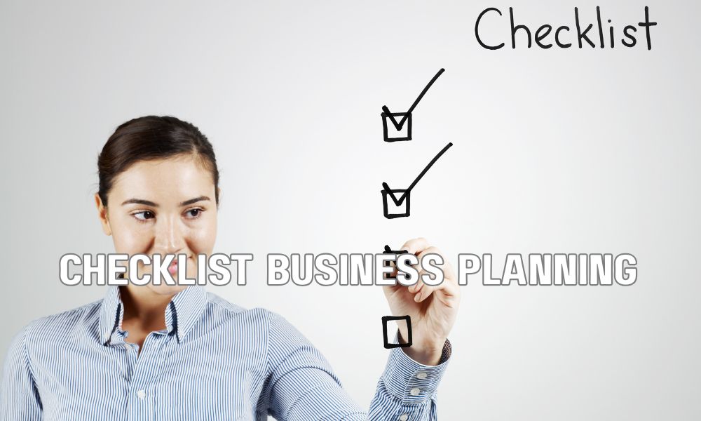 Business professionals using a hiring checklist to evaluate executive candidates systematically.