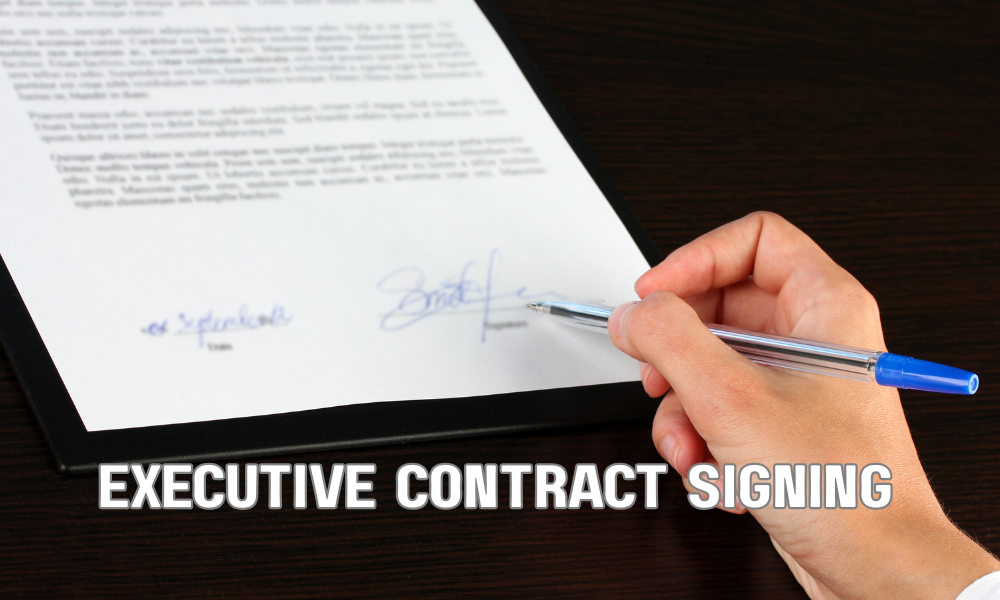 Senior executive reviewing a severance package agreement with company representatives during a corporate contract meeting.