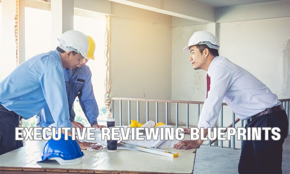 Executive Reviewing Blueprints